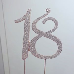The cake topper, rose gold with rhinestones